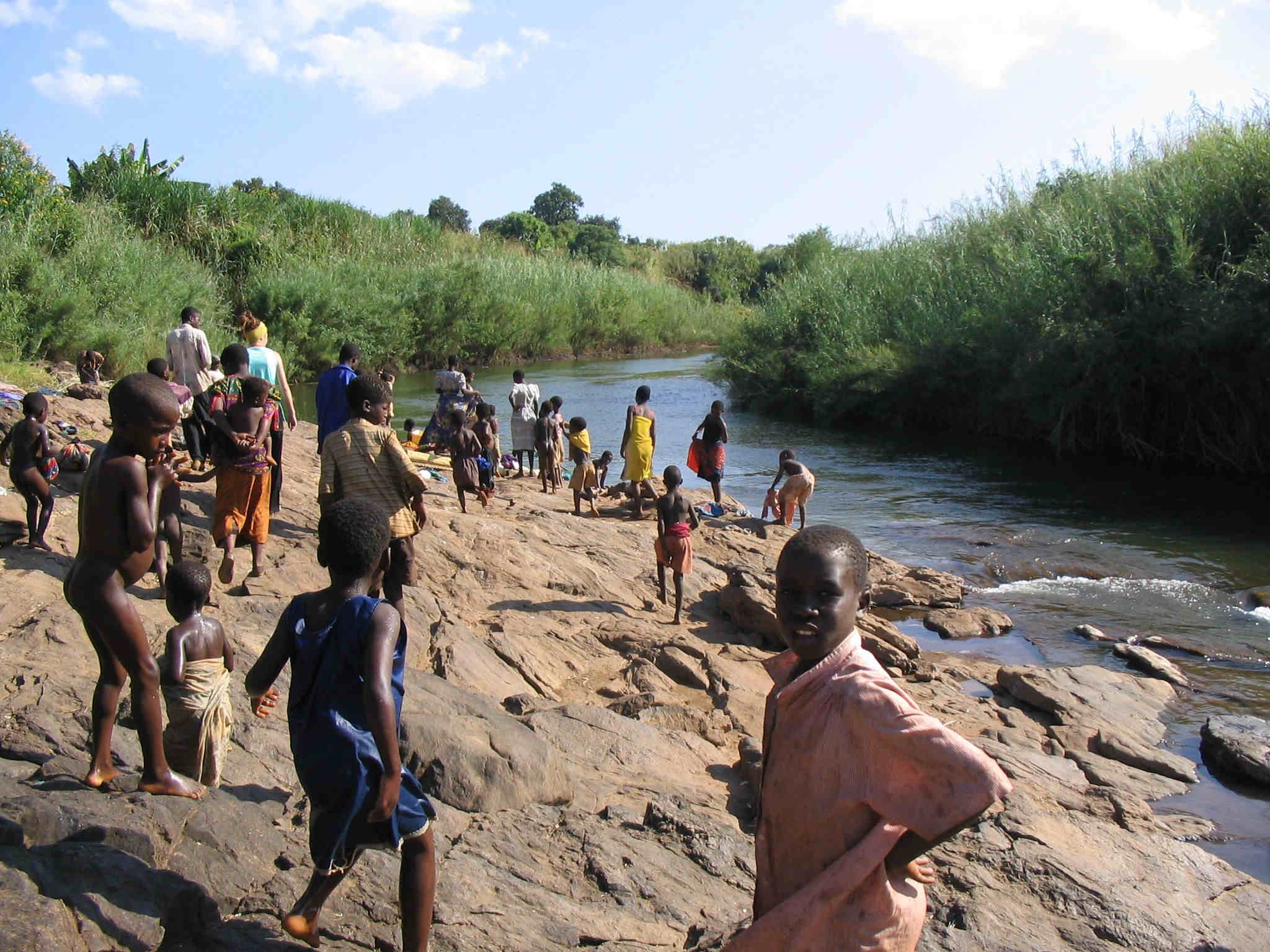 Malawians bathing in a river